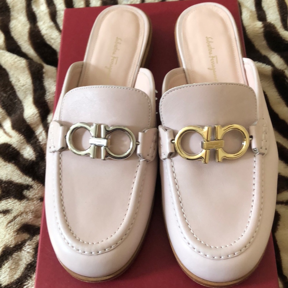 Brand new Ferragamo slides . Never worn and I did add protective sole . Size 7.5